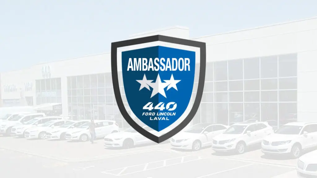 Ford Lincoln Laval dealership with Ambassador shield logo overlay.