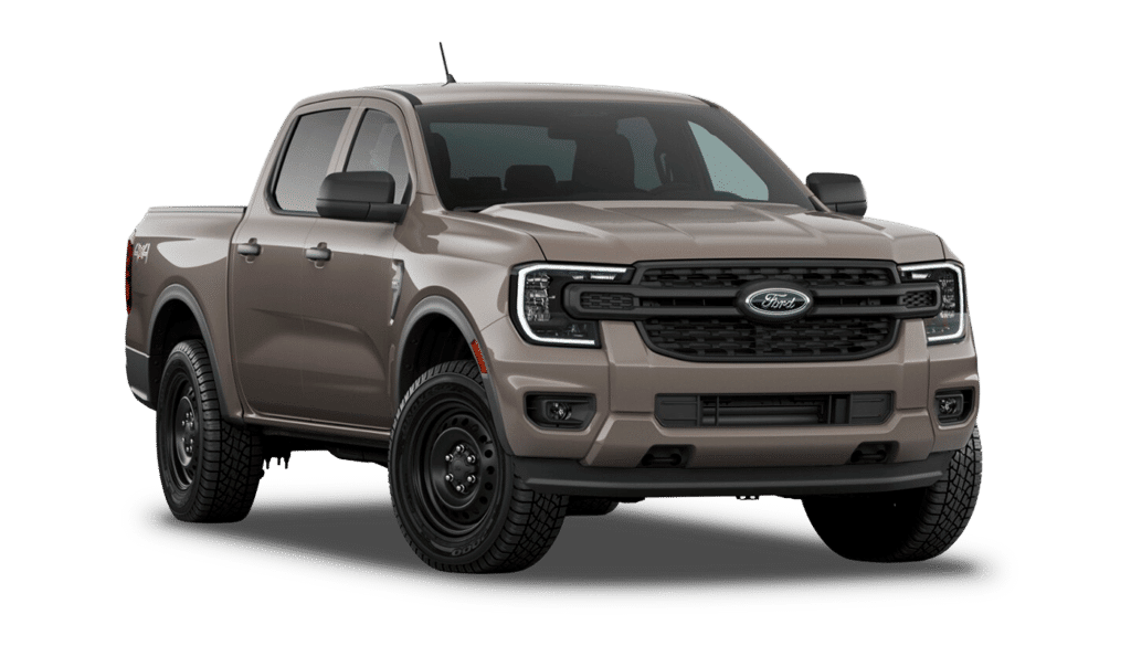 Pickup Ford couleur beige, vue de trois-quarts avant, pneus robustes et calandre distinctive.