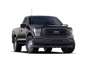 Pickup gris foncé de la marque Ford, vu de face, sur fond blanc. Phare LED et calandre avant imposante.