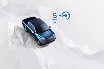 Camion bleu sur fond blanc polygonal avec indication de vitesse à 5 MPH et image de régulateur de vitesse.